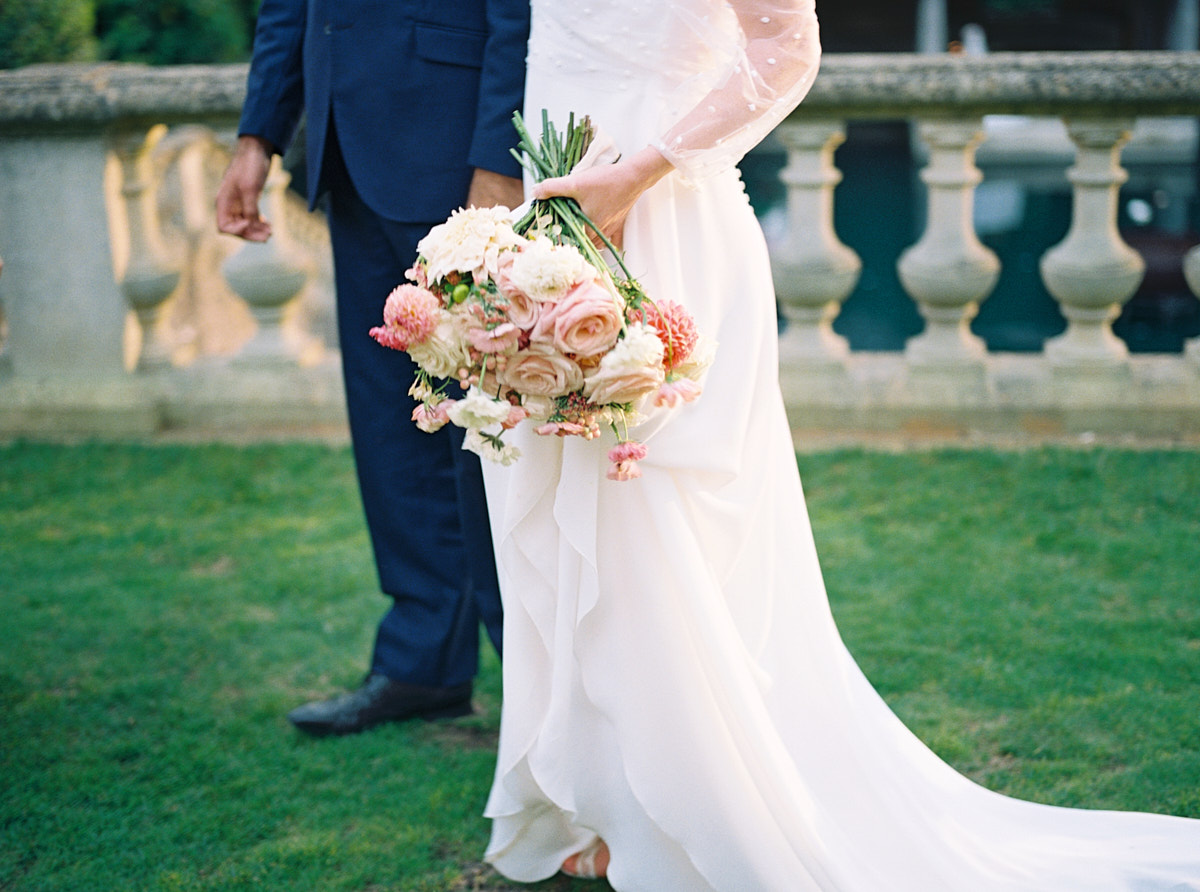 bride holding blush pink wedding bouquet