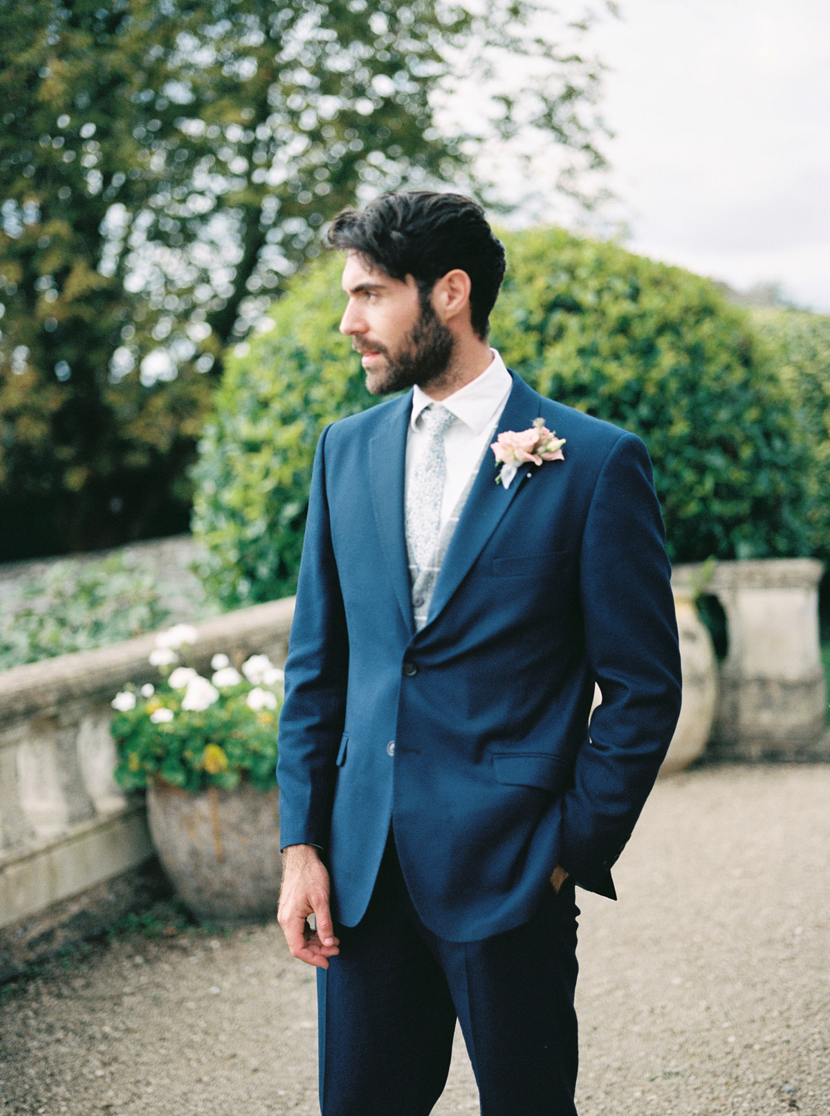 the groom wearing dark blue suit