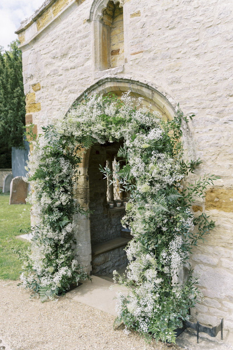 romantic whimsical Gypsophila church wedding flower arch in white colour