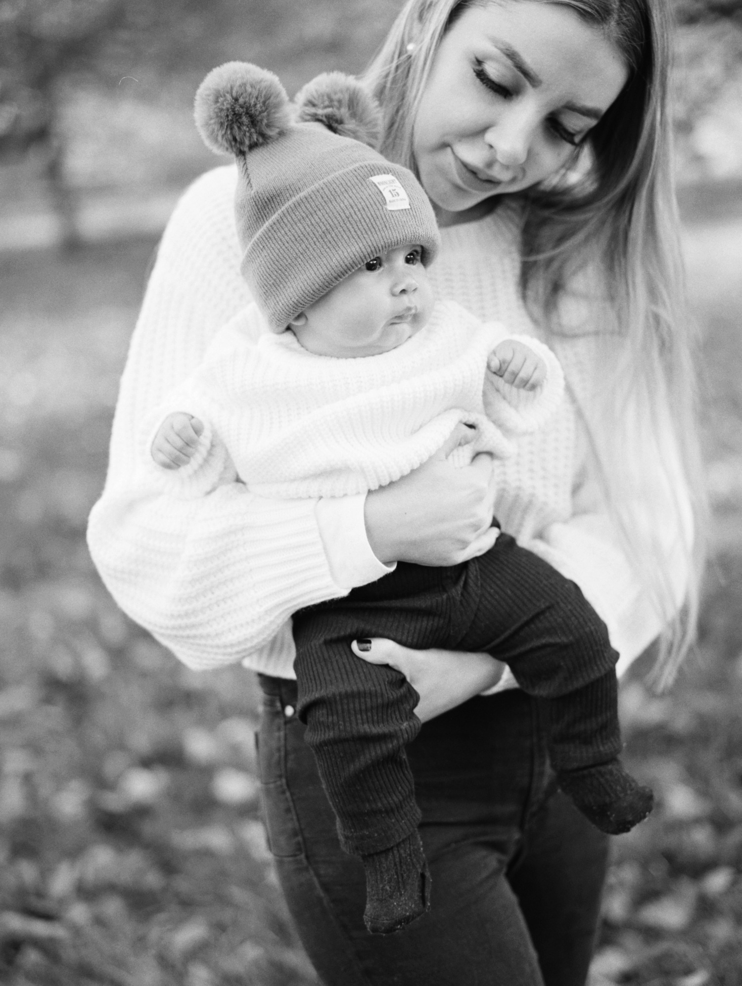 black and white photo of mother holding a baby